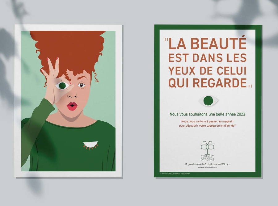 Carte de vœux pour les opticiens Cartalat représentant une illustration de femme au tein halé et aux cheveux crépus. Au verso de la carte est inscrit « La beauté est dans les yeux de celui qui regarde. »